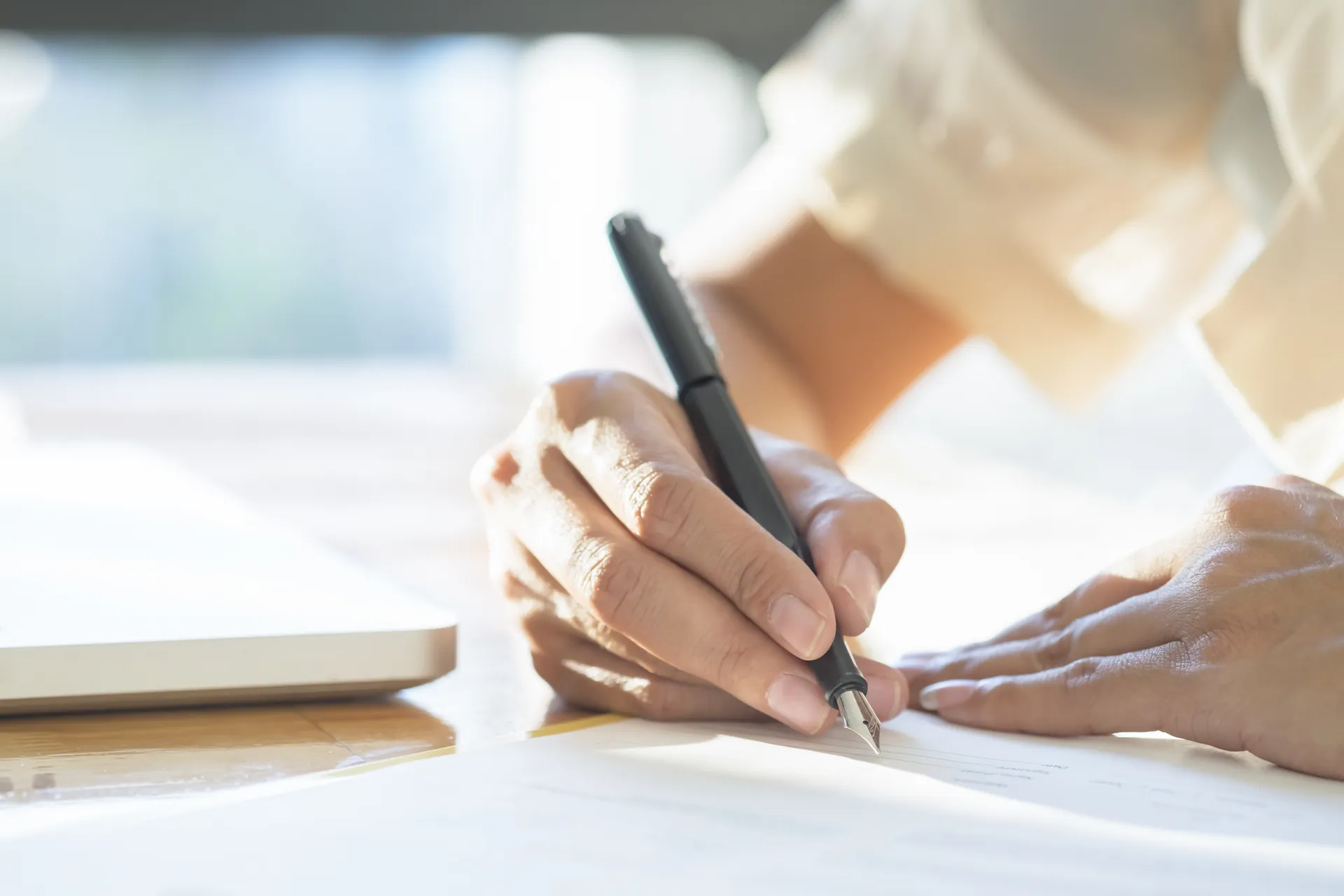 Asian Business woman signing a contract document making a deal. Asian Business woman signing a contract document making a deal.